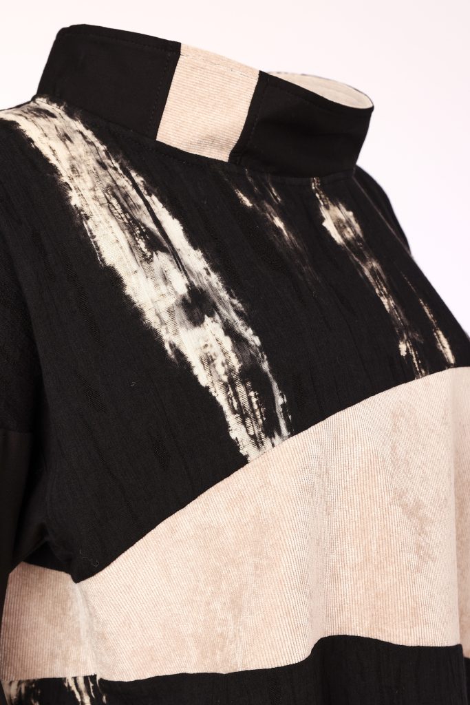 Naya High Neck Top With Corded Angle Section